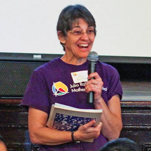 Nancy Blachman holds microphone