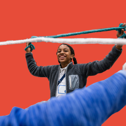 Girl holds rope smiling