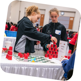 Girls play cup stacking. Photo credit: Amanda Kowalski and Lexey Swall, © MSRI